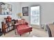Inviting sitting area featuring a comfortable chaise lounge, offering a relaxing space for reading or conversation at 3222 W Empedrado St, Tampa, FL 33629