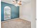 Cozy bedroom featuring a large window and statement wall at 4534 Cozzo Dr, Land O Lakes, FL 34639