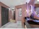 Stylish bathroom featuring sleek countertops, modern fixtures, and a view of a hallway at 5809 Cruiser Way, Tampa, FL 33615