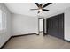 Spacious bedroom featuring a ceiling fan, neutral walls, and closet space, creating a serene retreat at 5809 Cruiser Way, Tampa, FL 33615