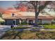 Beautiful single-story home boasting a tile roof, freshly manicured lawn, and professional landscaping at 5809 Cruiser Way, Tampa, FL 33615