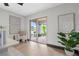 Bright home office with modern decor, neutral tones, and view through glass doors at 5809 Cruiser Way, Tampa, FL 33615