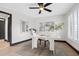 Inviting home office features modern furniture, a stylish ceiling fan, and plenty of natural light at 5809 Cruiser Way, Tampa, FL 33615
