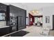 The gourmet kitchen features premium appliances, sleek cabinetry, and a large island with a cooktop at 5809 Cruiser Way, Tampa, FL 33615