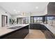 Modern kitchen featuring sleek black cabinetry, stone countertops, and stainless steel appliances at 5809 Cruiser Way, Tampa, FL 33615