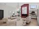 The spacious living area is enhanced by a fireplace, modern light fixture, and cozy furniture at 5809 Cruiser Way, Tampa, FL 33615