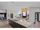 Open-concept living space with kitchen island, modern lighting, and inviting living area at 5809 Cruiser Way, Tampa, FL 33615