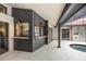 Outdoor patio area with a built-in bar, in-ground pool and tile flooring at 5809 Cruiser Way, Tampa, FL 33615