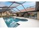 Screened-in pool area with ample space for outdoor lounging and entertaining at 5809 Cruiser Way, Tampa, FL 33615