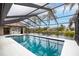 Screened-in pool area offering a view of the waterfront at 5809 Cruiser Way, Tampa, FL 33615