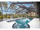 A screened-in pool with views of the water and surrounding greenery at 5809 Cruiser Way, Tampa, FL 33615