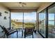 This screened balcony is a perfect spot for outdoor relaxation and enjoying the waterfront views at 6218 Palma Del Mar S Blvd # 208, St Petersburg, FL 33715