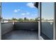 Balcony area with black tiled flooring and privacy wall at 807 W Park Ave, Tampa, FL 33602