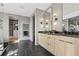 Elegant bathroom featuring a modern double vanity, walk-in closet, and glass shower at 807 W Park Ave, Tampa, FL 33602