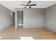Open bedroom area boasting hardwood floors, a contemporary ceiling fan, and a spacious closet at 807 W Park Ave, Tampa, FL 33602