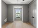 Charming bedroom with light wood floors and a window nook creating a cozy space filled with natural light at 807 W Park Ave, Tampa, FL 33602