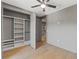 Bedroom with a custom closet system, wood floors, gray walls and trim, offering a blend of style and storage at 807 W Park Ave, Tampa, FL 33602