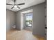 Bedroom boasts wood floors, gray walls, and a window nook that provides natural light at 807 W Park Ave, Tampa, FL 33602