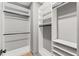 Walk-in closet with custom shelving and rods, offering ample storage space for an organized wardrobe at 807 W Park Ave, Tampa, FL 33602