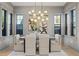 This dining room features modern light fixtures, hardwood floors, and lots of natural light at 807 W Park Ave, Tampa, FL 33602