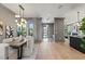 This dining room features hardwood floors and an elegant chandelier above a large wooden dining table at 807 W Park Ave, Tampa, FL 33602