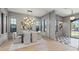 Elegant dining room with modern chandelier, neutral decor, and a glimpse into the entryway at 807 W Park Ave, Tampa, FL 33602