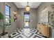 Stunning home entryway featuring decorative tile floors, contemporary lighting, and neutral wall colors at 807 W Park Ave, Tampa, FL 33602
