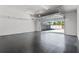 Bright and spacious garage with an epoxy floor and view to the backyard at 807 W Park Ave, Tampa, FL 33602