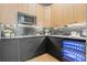 Updated kitchen with custom cabinets, tile backsplash, and built-in wine cooler at 807 W Park Ave, Tampa, FL 33602