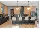 Stylish modern kitchen features black countertops, tile backsplash, and light wood cabinets at 807 W Park Ave, Tampa, FL 33602