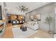 Open-concept living room boasts lots of natural light, hardwood flooring, and a modern fireplace at 807 W Park Ave, Tampa, FL 33602
