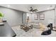 Inviting living room featuring stylish furniture, wood floors, and ample natural light perfect for relaxation and entertaining at 807 W Park Ave, Tampa, FL 33602