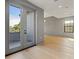 Bright living room with large windows and hardwood floors at 807 W Park Ave, Tampa, FL 33602