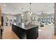 Open-concept living space showcasing kitchen island, living room, and dining area at 807 W Park Ave, Tampa, FL 33602