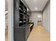 Mudroom with built-in storage, bench, and desk leading to bathroom and stairway at 807 W Park Ave, Tampa, FL 33602