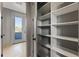 Walk-in pantry featuring ample shelving, offering plenty of storage space with easy access to the balcony at 807 W Park Ave, Tampa, FL 33602