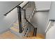 Staircase with a modern black railing and natural light at 807 W Park Ave, Tampa, FL 33602