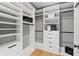 Well-organized walk-in closet with white shelving and drawers for optimal storage at 807 W Park Ave, Tampa, FL 33602