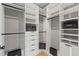 Organized walk-in closet featuring white shelving and drawers with matte black hardware at 807 W Park Ave, Tampa, FL 33602