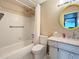Cozy bathroom with a shower-tub combo and a vanity with a marble countertop at 8330 Vendome N Blvd, Pinellas Park, FL 33781