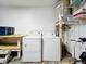 Functional laundry room with a washer, dryer, and ample storage space at 8330 Vendome N Blvd, Pinellas Park, FL 33781