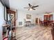 An open living area with wood floors, ceiling fans, and natural light creates a comfortable and inviting atmosphere at 8330 Vendome N Blvd, Pinellas Park, FL 33781