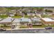 Charming single-story homes line a quiet street with manicured lawns and mature trees create inviting curb appeal at 8330 Vendome N Blvd, Pinellas Park, FL 33781