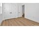 Bedroom with modern closet doors and wood-look flooring at 8347 Golden Beach Ct, Parrish, FL 34219
