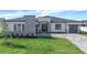 Beautiful single Gathering home featuring a modern exterior with brick driveway, lawn and minimalist landscaping at 8347 Golden Beach Ct, Parrish, FL 34219