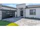 Single Gathering home exterior featuring a modern garage door and landscaping in a well maintained lawn at 8347 Golden Beach Ct, Parrish, FL 34219