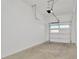 Well-lit garage interior with white walls and concrete floor at 8347 Golden Beach Ct, Parrish, FL 34219