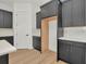 Kitchen features dark cabinets, built in refrigerator, and white countertops at 8347 Golden Beach Ct, Parrish, FL 34219