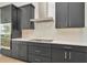 Modern kitchen features ample dark cabinets, stainless steel appliances, and a white countertop at 8347 Golden Beach Ct, Parrish, FL 34219