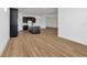 Open space living area with kitchen visible in background featuring stainless steel appliances at 8347 Golden Beach Ct, Parrish, FL 34219